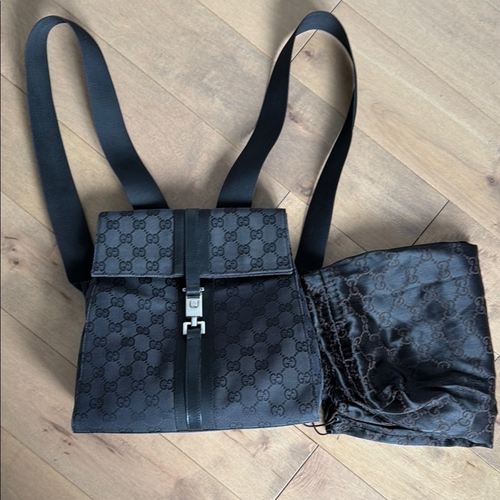 Gucci Black Monogram Backpack with Silver Hardware, with storage bag.